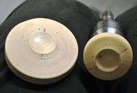 Turned cups for holding a sphere