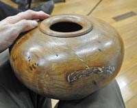Hollow form with metal inlay