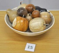 Turned wooden fruit in bowl
