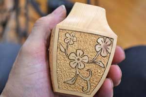 Textured and pyrographed pot