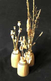 bud vase with grasses and poppies